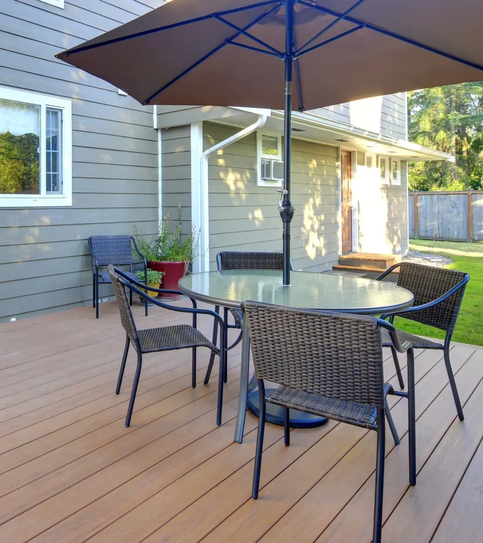 Brown composite deck with outdoor patio set
