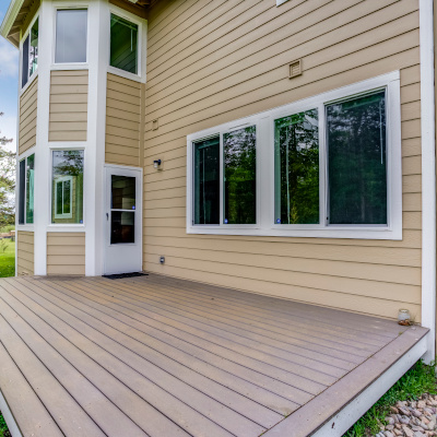 Red composite backyard deck with modern design and low-maintenance materials